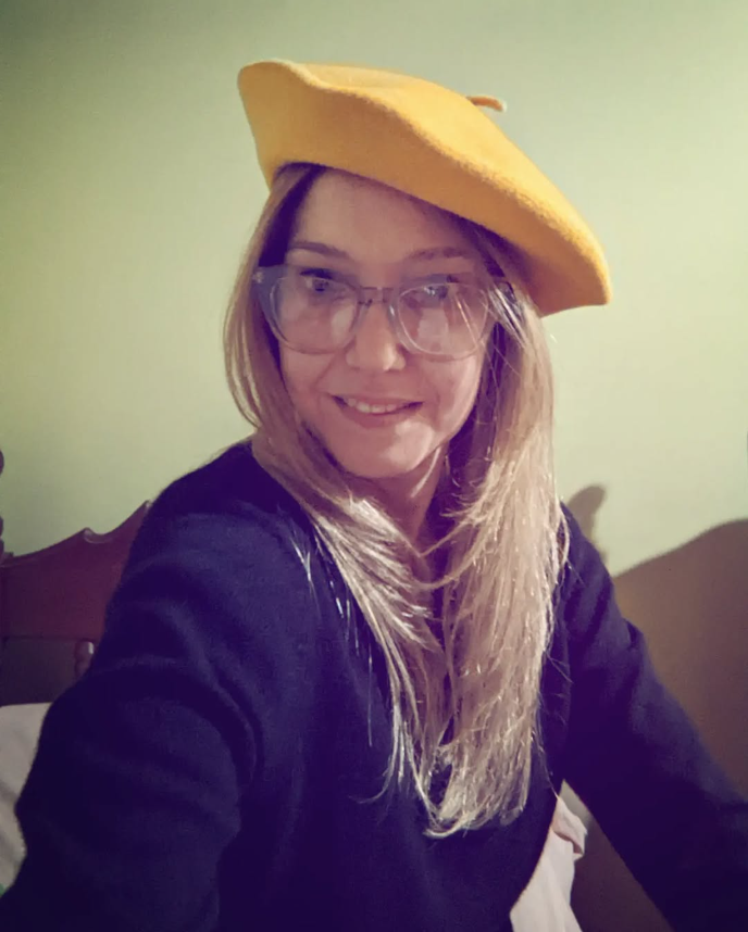 Mylene Hernández wearing a yellow beret
